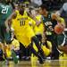 Michigan sophomore Tim Hardaway Jr. guards Ohio University sophomore Nick Kellogg in the first half of the second round of the NCAA tournament at Bridgestone Arena in Nashville, Tenn.  Melanie Maxwell I AnnArbor.com